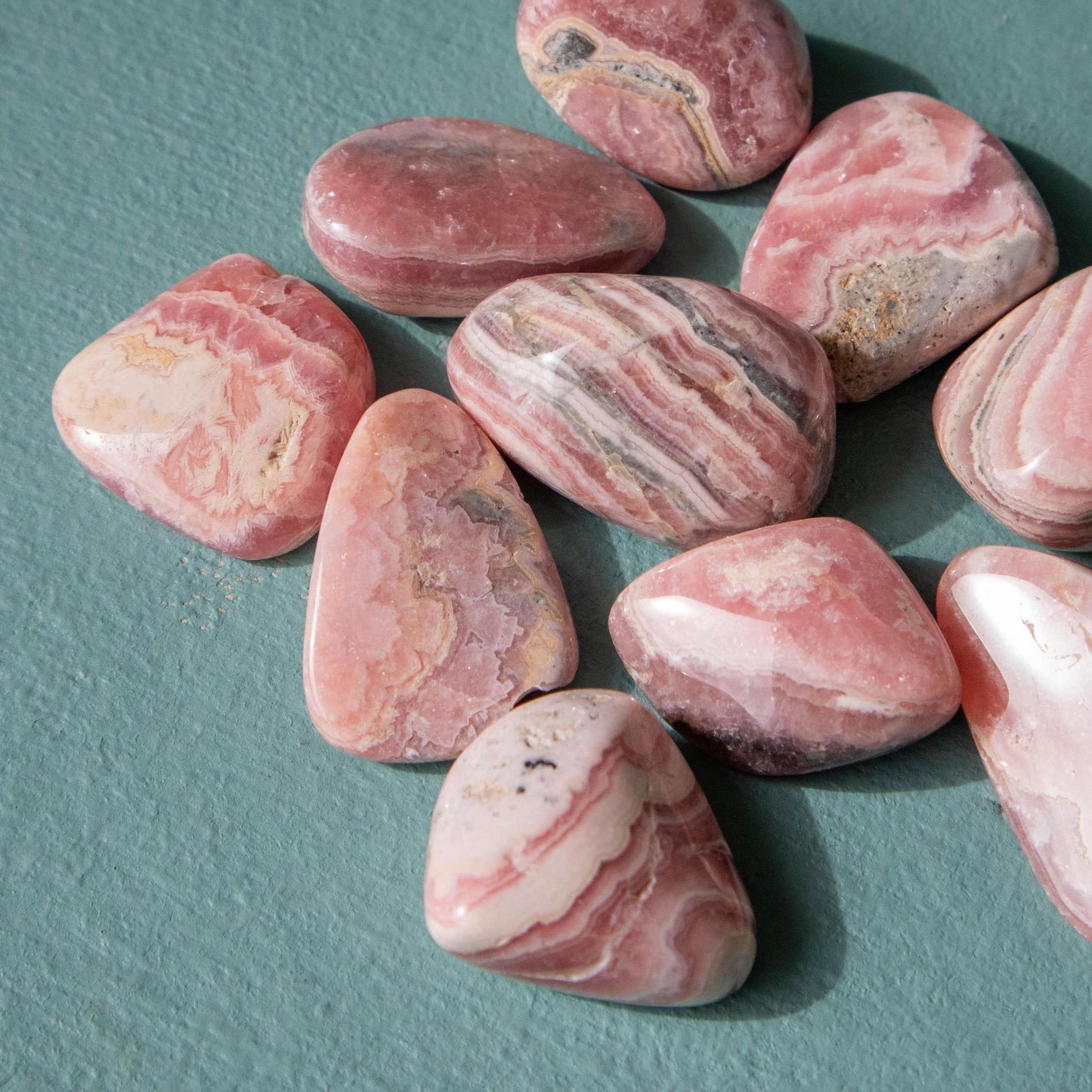 rhodochrosite, rhodochrosite tumble, rhodochrosite tumbled stone, crystal tumble, small crystal tumble, small tumbled stone, rhodochrosite crystal, rhodochrosite stone, rhodochrosite properties, rhodochrosite healing properties, rhodochrosite metaphysical properties, rhodochrosite meaning