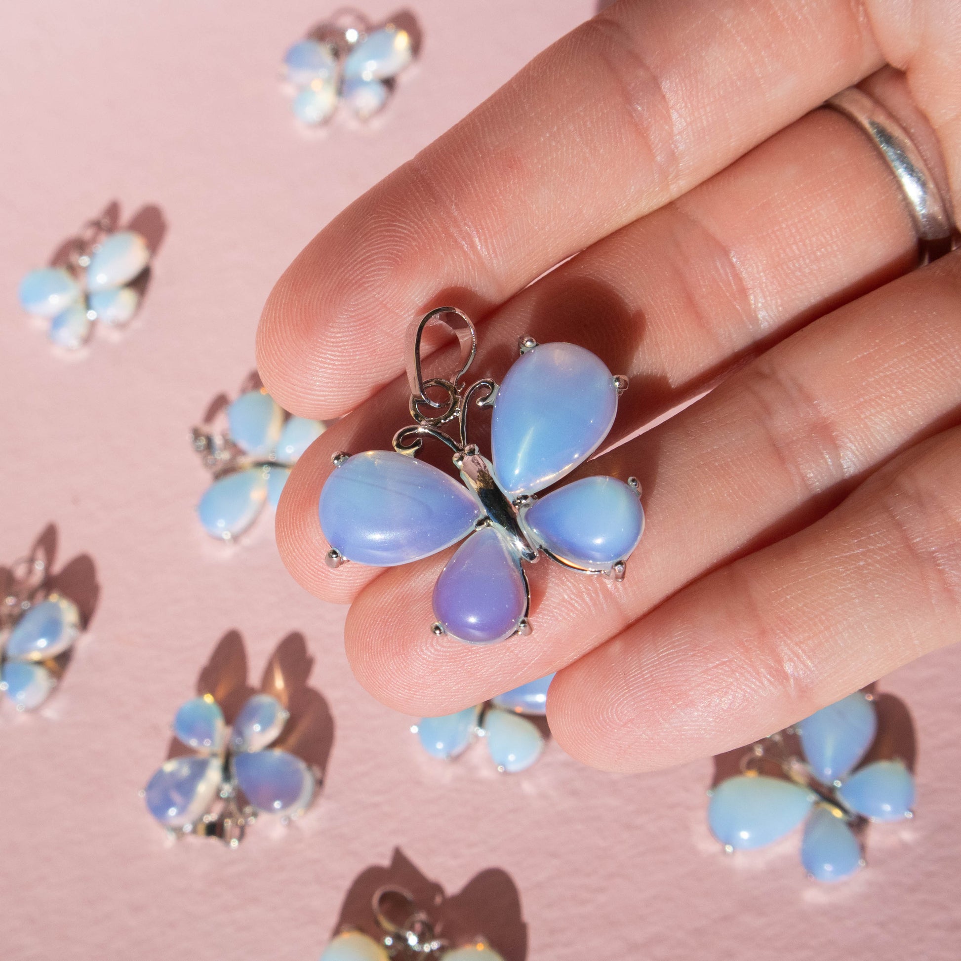 opalite, opalite butterfly pendant, opalite jewelry, crystal butterfly pendant, crystal pendant, crystal jewelry, gemstone pendant, gemstone jewelry, opalite crystal, opalite stone, opalite properties, opalite healing properties, opalite metaphysical properties, opalite meaning