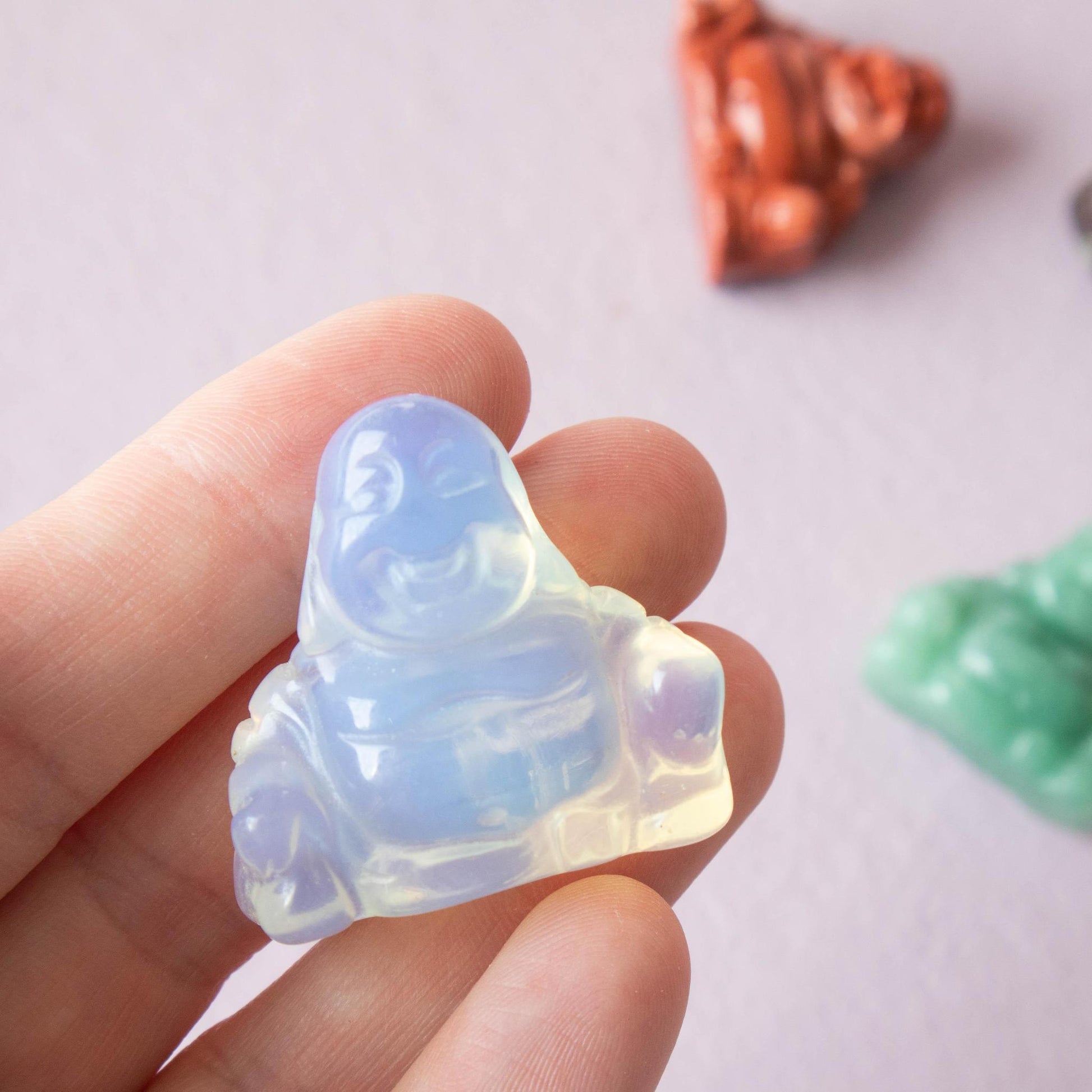 opalite, opalite buddha, opalite happy buddha carving, crystal buddha, opalite crystal, opalite stone, opalite properties, opalite healing properties, opalite meaning